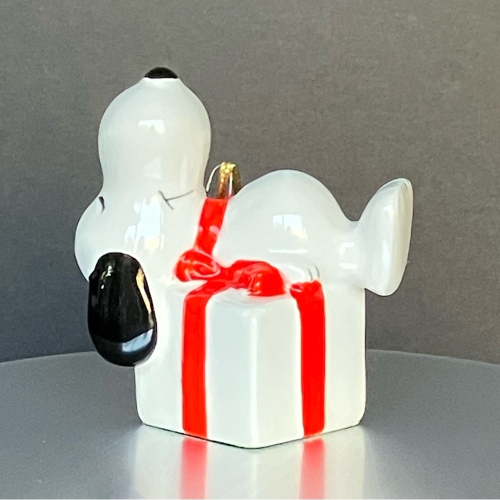 Vintage Snoopy Napping on a Present Ceramic Ornament - United Feature Syndicate